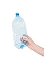 Female hand holding empty crushed blue plastic bottle isolated on white. Recyclable waste. Recycling, reuse, garbage Royalty Free Stock Photo