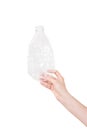 Female hand holding empty crushed plastic bottle isolated on white. Recyclable waste. Recycling, reuse, garbage disposal Royalty Free Stock Photo