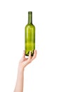 Female hand holding empty glass bottle isolated on white. Recyclable waste. Recycling, reuse, garbage disposal, resources, environ Royalty Free Stock Photo