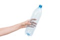 Female hand holding empty plastic bottle isolated on white. Recyclable waste. Recycling, reuse, garbage disposal Royalty Free Stock Photo