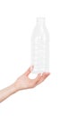 Female hand holding empty plastic bottle isolated on white. Recyclable waste. Recycling, reuse, garbage disposal, resources, envir Royalty Free Stock Photo