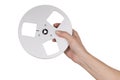 Female hand holding empty reel of tape recorder Royalty Free Stock Photo
