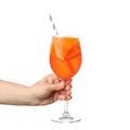 Female hand holding glass aperol spritz cocktail, isolated on white background Royalty Free Stock Photo