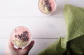 Female hand holding the glass of strawberry smoothie Royalty Free Stock Photo