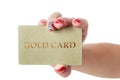 Female hand holding gold credit card isolated Royalty Free Stock Photo