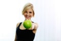 Female hand holding green apple Royalty Free Stock Photo