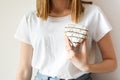 Female hand holding heart shaped donut Royalty Free Stock Photo