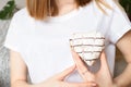 Female hand holding heart shaped donut Royalty Free Stock Photo