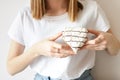 Female hand holding heart shaped donut Royalty Free Stock Photo