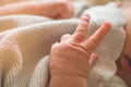 Female hand holding her newborn baby hand. Mom with her child. Maternity, family, birth concept Royalty Free Stock Photo