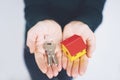 Female hand holding house key, real estate agent Royalty Free Stock Photo
