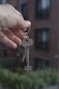 Female Hand Holding House Keys .agent handing over house keys in hand. Close-up view of keys from new home Royalty Free Stock Photo