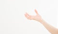 Female hand holding invisible items, woman`s palm making gesture while showing small amount of something on white isolated Royalty Free Stock Photo