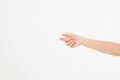 Female hand holding invisible items, woman`s palm making gesture while showing small amount of something on white isolated backgr Royalty Free Stock Photo