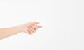 Female hand holding invisible items, woman`s palm making gesture while showing small amount of something on white isolated backgr Royalty Free Stock Photo