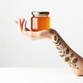 Female hand holding a jar of sweet honey. Healthy foods. AI generated Royalty Free Stock Photo