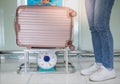 Female hand holding the luggage suitcase weighting on the kilo scales for check the weight prepare check-in at the airport Royalty Free Stock Photo