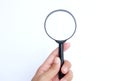 Female hand holding  Magnifying glass  isolate on a white background Royalty Free Stock Photo