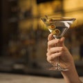 Female hand holding martini. Royalty Free Stock Photo