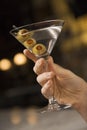 Female hand holding martini. Royalty Free Stock Photo