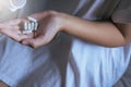 Female hand holding a medicine,Woman hands with pills on spilling pills out of bottle Royalty Free Stock Photo