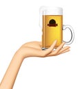 Female hand holding on the palm a glass mug with a beer and label isolated on white