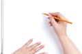 Female hand holding a pencil drawing on white whatman paper in an album. Royalty Free Stock Photo