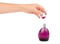 Female hand holding perfume bottle. Isolated on white background Royalty Free Stock Photo