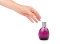 Female hand holding perfume bottle. Isolated on white background Royalty Free Stock Photo