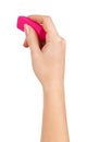 Female hand holding a pink eraser to erase