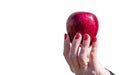 Female hand holding a red apple closeup Royalty Free Stock Photo