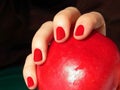 Female hand holding red apple Royalty Free Stock Photo
