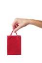 Female hand holding red gift bag Royalty Free Stock Photo