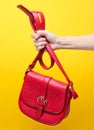 Female hand holding red leather bag Royalty Free Stock Photo