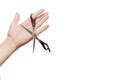 Female hand holding scissors. European