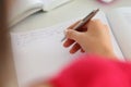 Female hand holding silver pen closeup Royalty Free Stock Photo