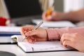 Female hand holding silver pen closeup Royalty Free Stock Photo