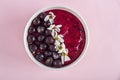 Female hand holding smoothie bowl with acai, banana, blueberries, kiwi fruit and black currants. Healthy super food with fresh Royalty Free Stock Photo