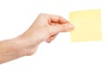 Female hand holding a sticky note