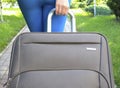 Female hand holding suitcase Royalty Free Stock Photo