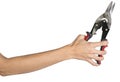 Female hand holding tin snips Royalty Free Stock Photo