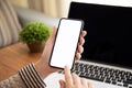 Female hands holding touch phone with isolated screen in office Royalty Free Stock Photo