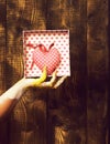 Female hand holding valentine heart Royalty Free Stock Photo