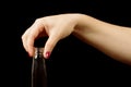 Female hand holding vodka bottle Royalty Free Stock Photo