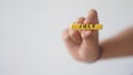 Female hand holding wooden block of calendar with month July