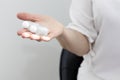 Female Hand Holds Clear Transparent Glass Bottles, Vials With Cosmetics, Lotion, Fluid