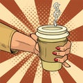 Female hand holds hot cardboard cup with coffee comic style. During a working break she drinks energy drink. Vintage pop