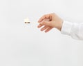 Female hand holds lit match. Wooden matchstick with fire. Fire Hazard concept Royalty Free Stock Photo