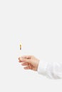 Female hand holds lit match. Wooden matchstick with fire. Fire Hazard concept. Royalty Free Stock Photo