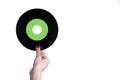 Female hand holds a 45 rpm vinyl record. Royalty Free Stock Photo